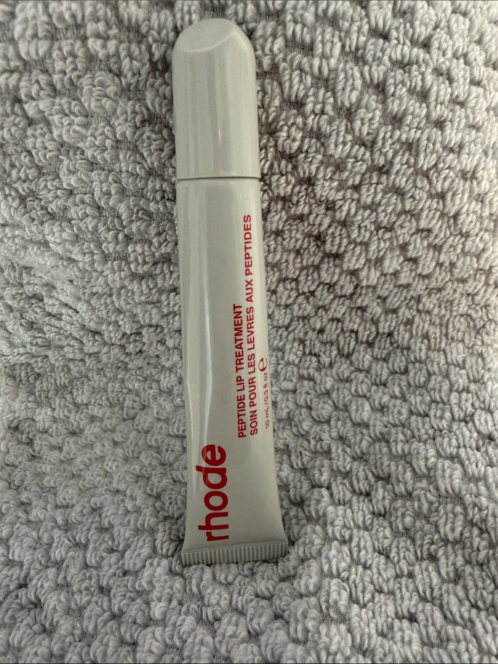 RHODE White Lip Treatment Tube with Red Logo